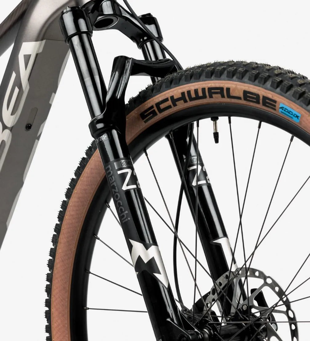 Close-up of a bicycle wheel with Schwalbe tyre on a white background