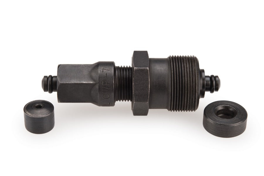 Black bicycle crank tool on a white background