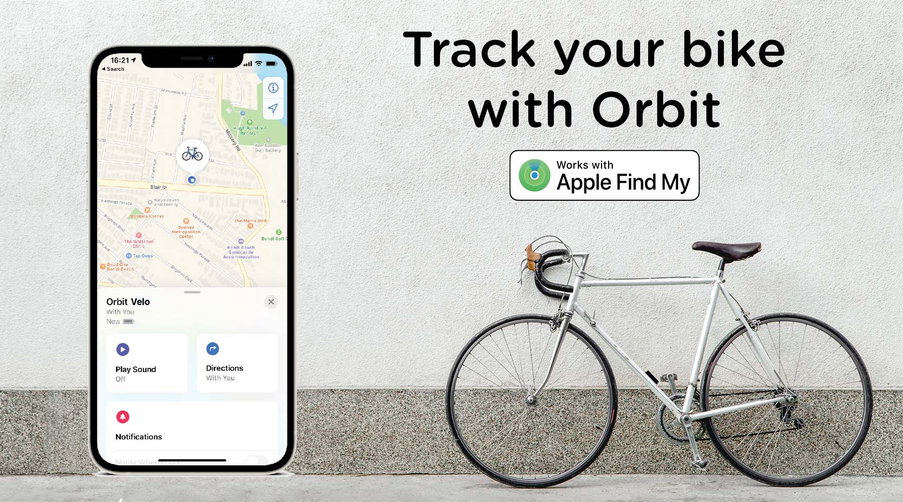 Smartphone displaying a bike tracking app with a bicycle on a concrete surface.