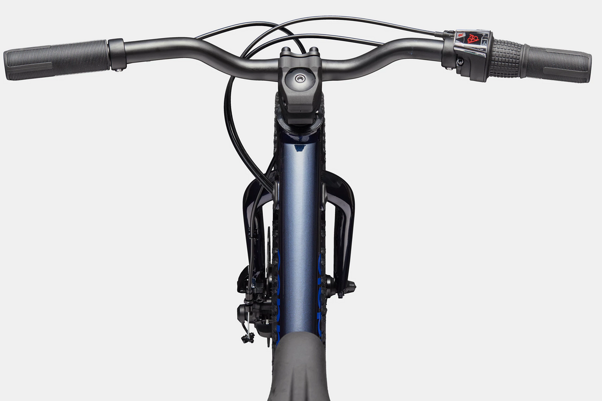 Close up of a blue handlebar and top tube of a kids mountain bike on a white background