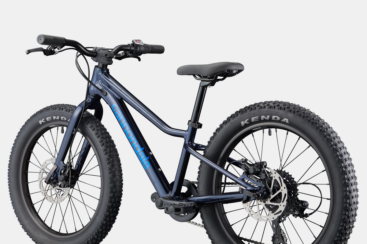 Blue Cannondale kids mountain bike on a white background