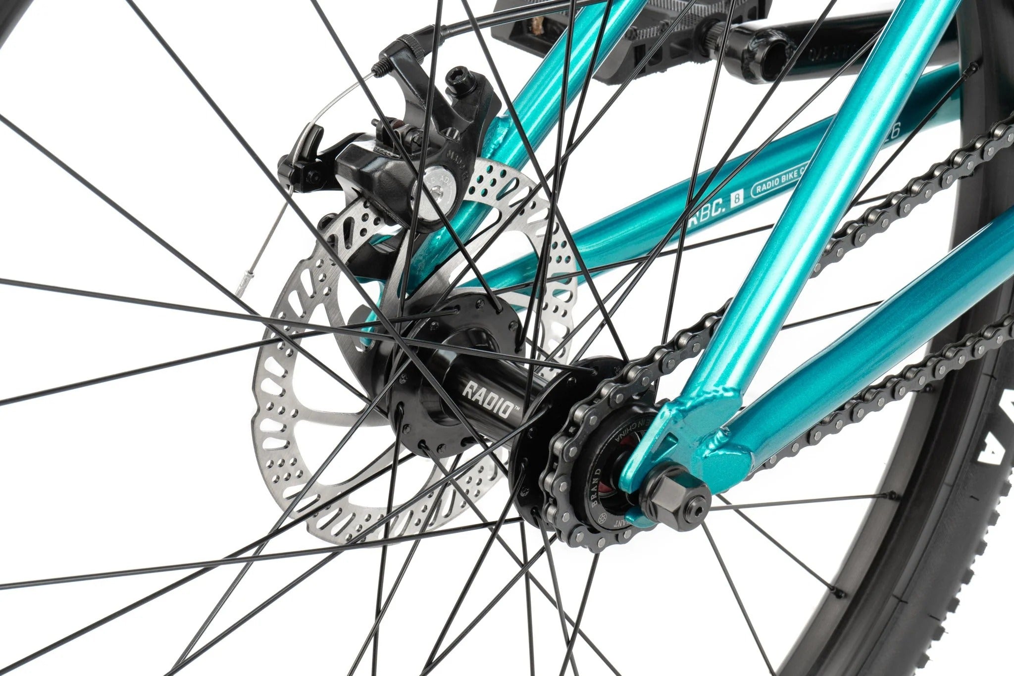 Close-up of a bicycle wheel with turquoise blue frame and black components.