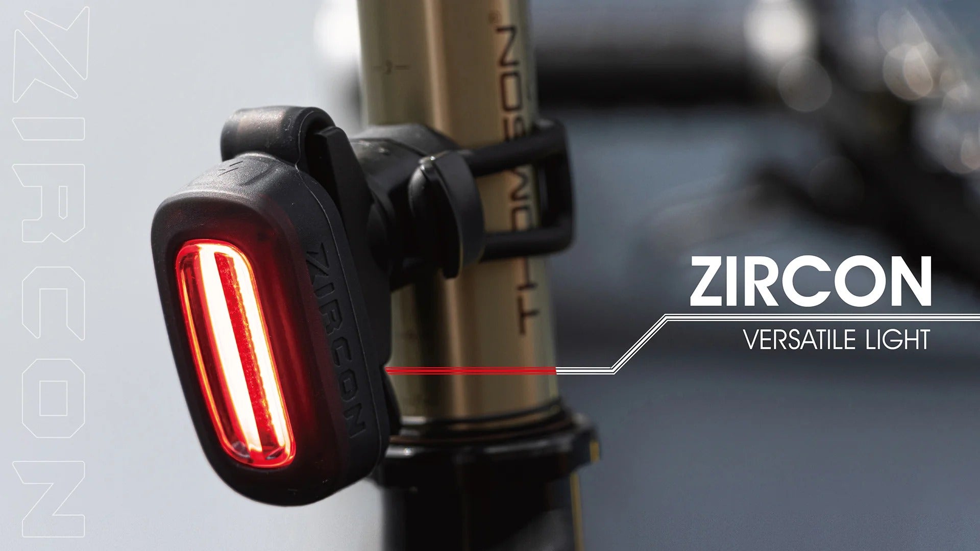 Bicycle tail light with 'Zircon' branding on a blurred background