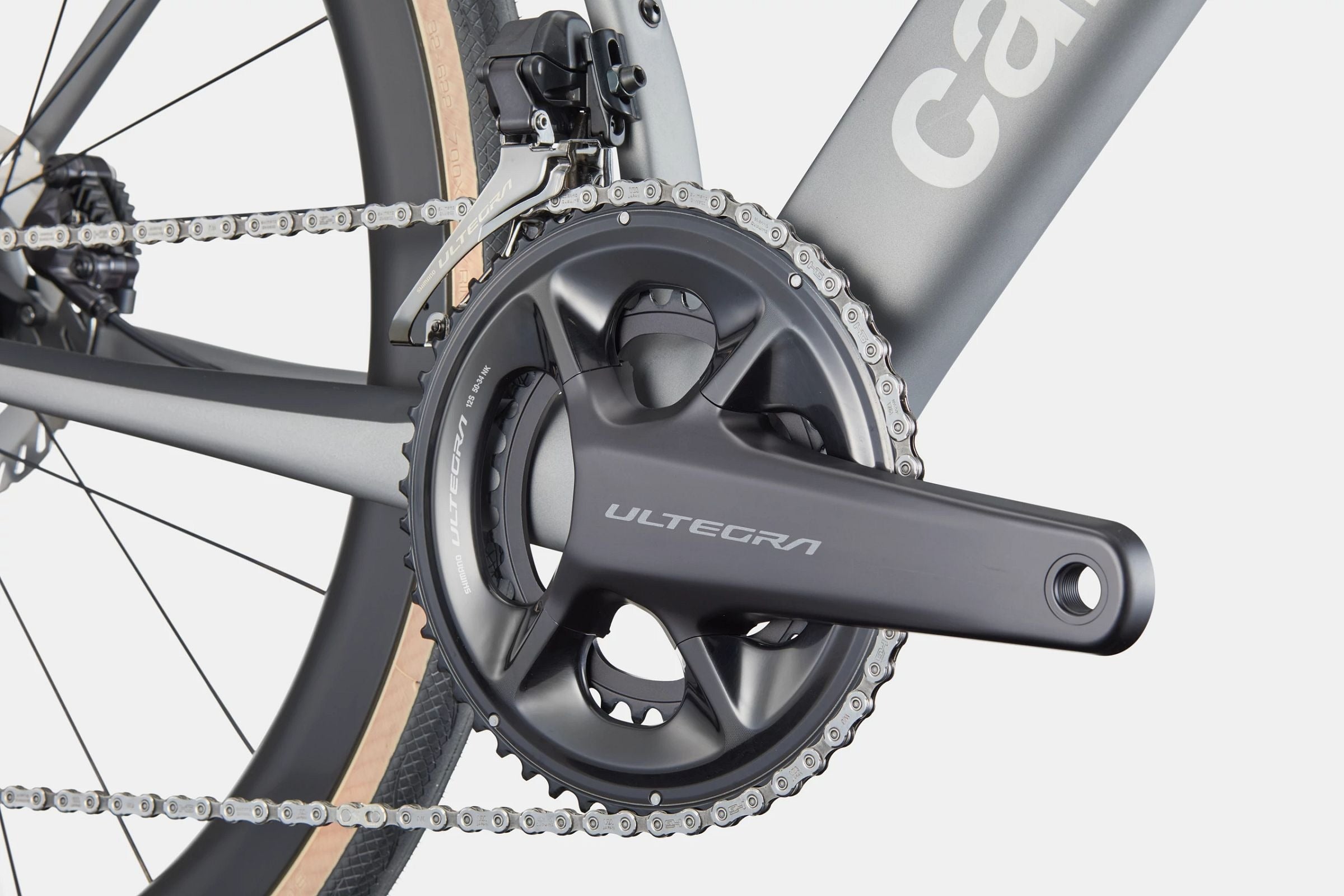 Close-up of a road bike front Ultegra chain ring on a white background.