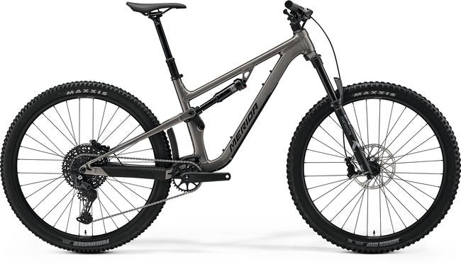 A grey Merida Dual Suspension Mountain Bike on a white background
