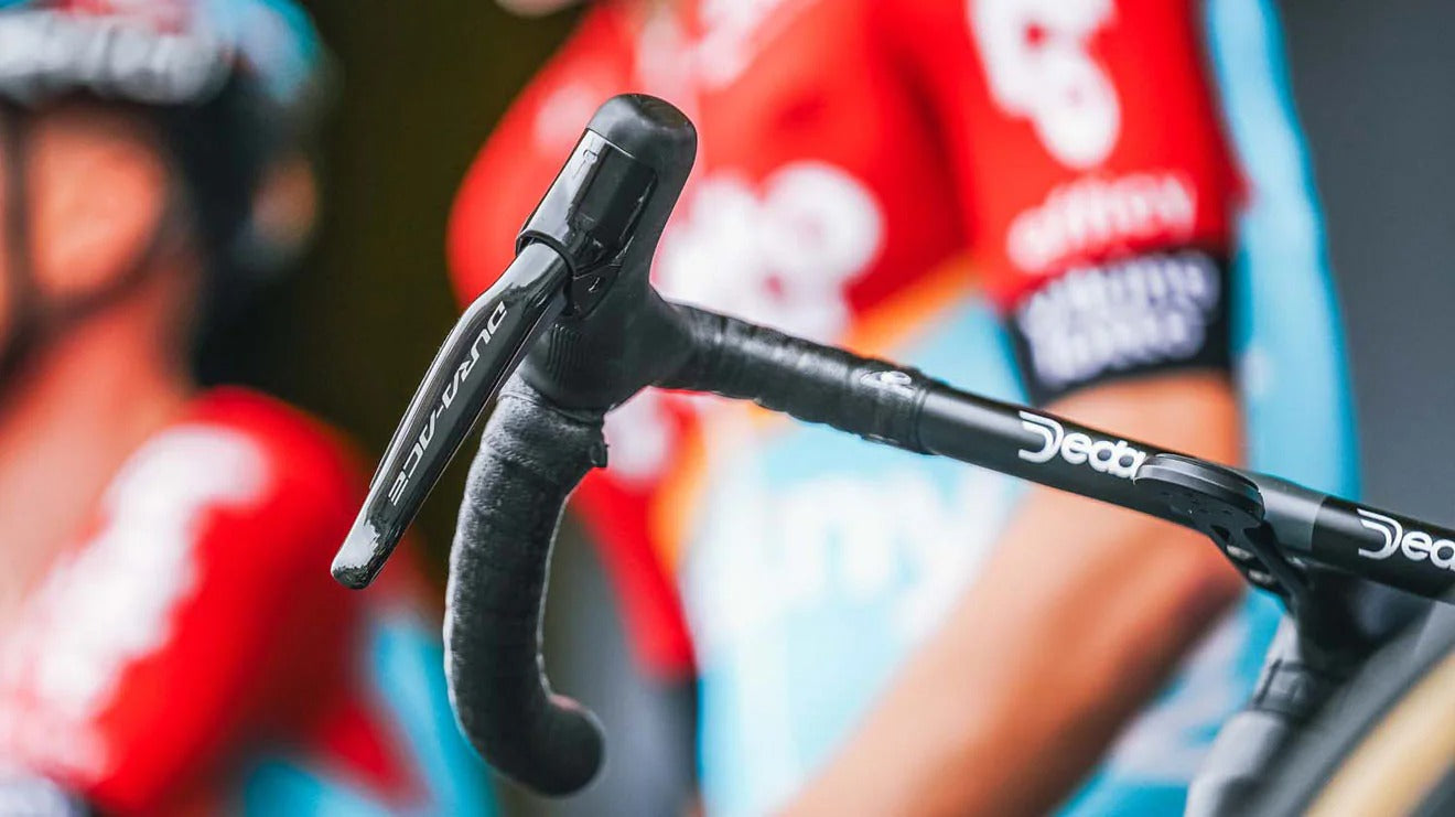 Close-up of road bike handlebars with a  blurred background