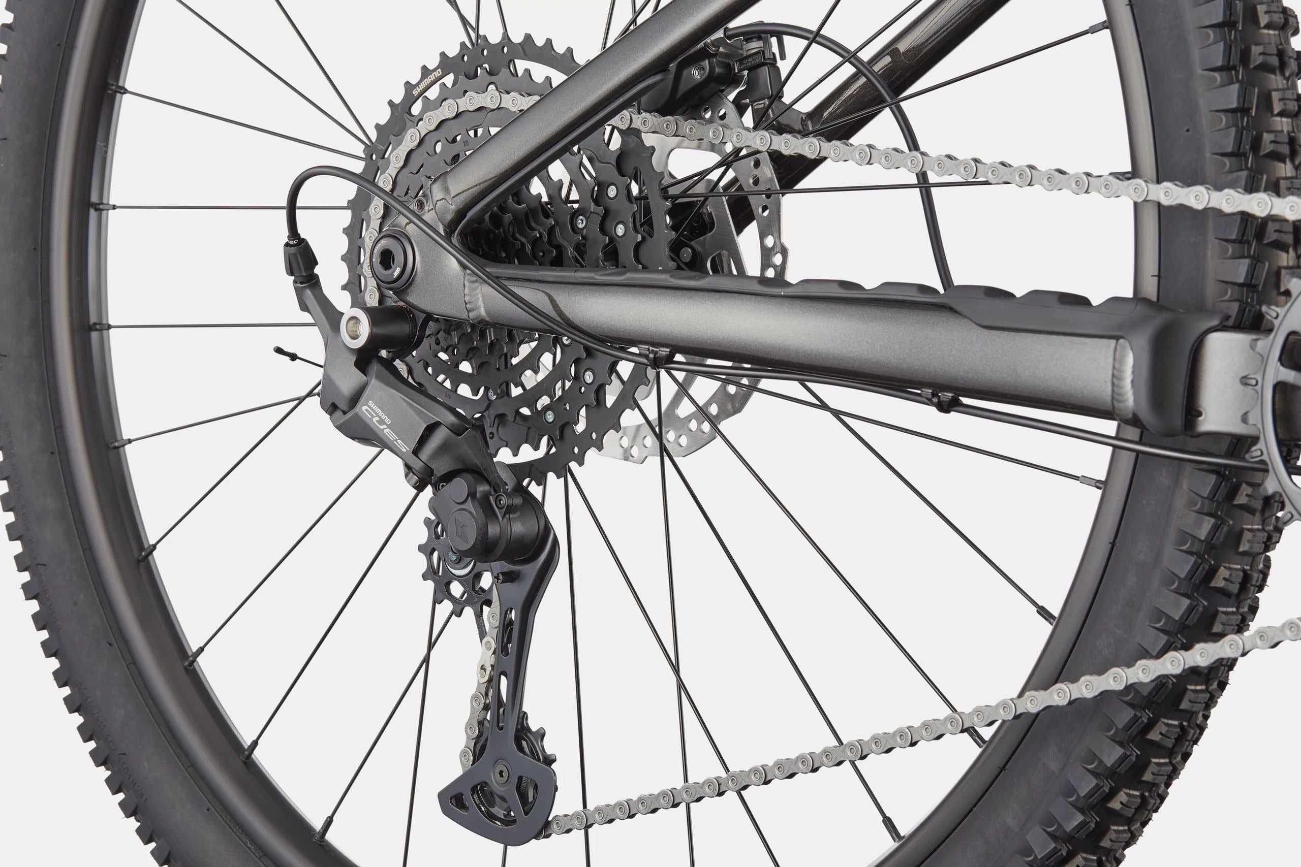Close-up of a mountain bike's gear system on a white background
