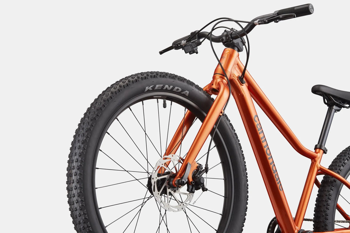 Orange Cannondale mountain bike on a white background