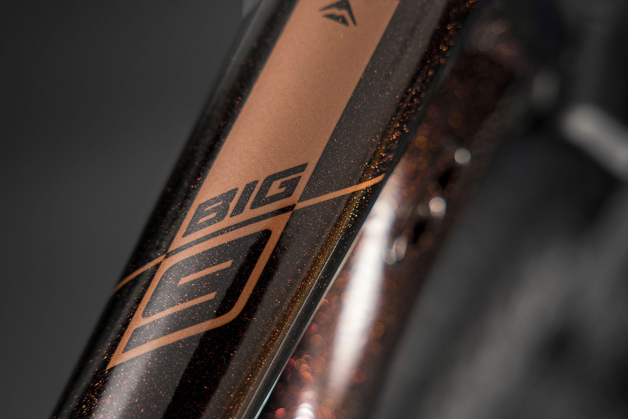Close up of the Merida Big Nine mountain bike top tube with a blurred background