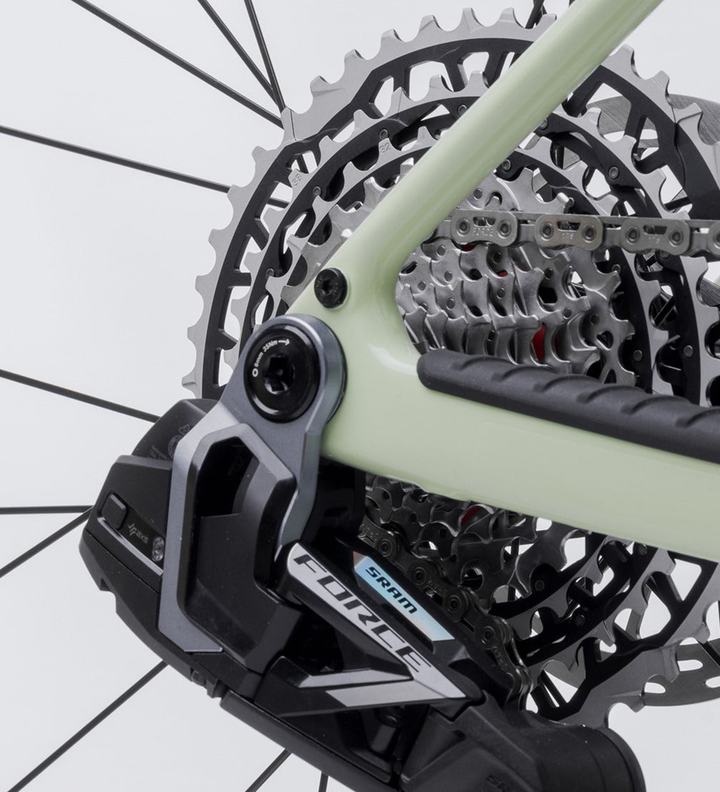 Close-up of a bicycle chainset with SRAM Force branding on a white background
