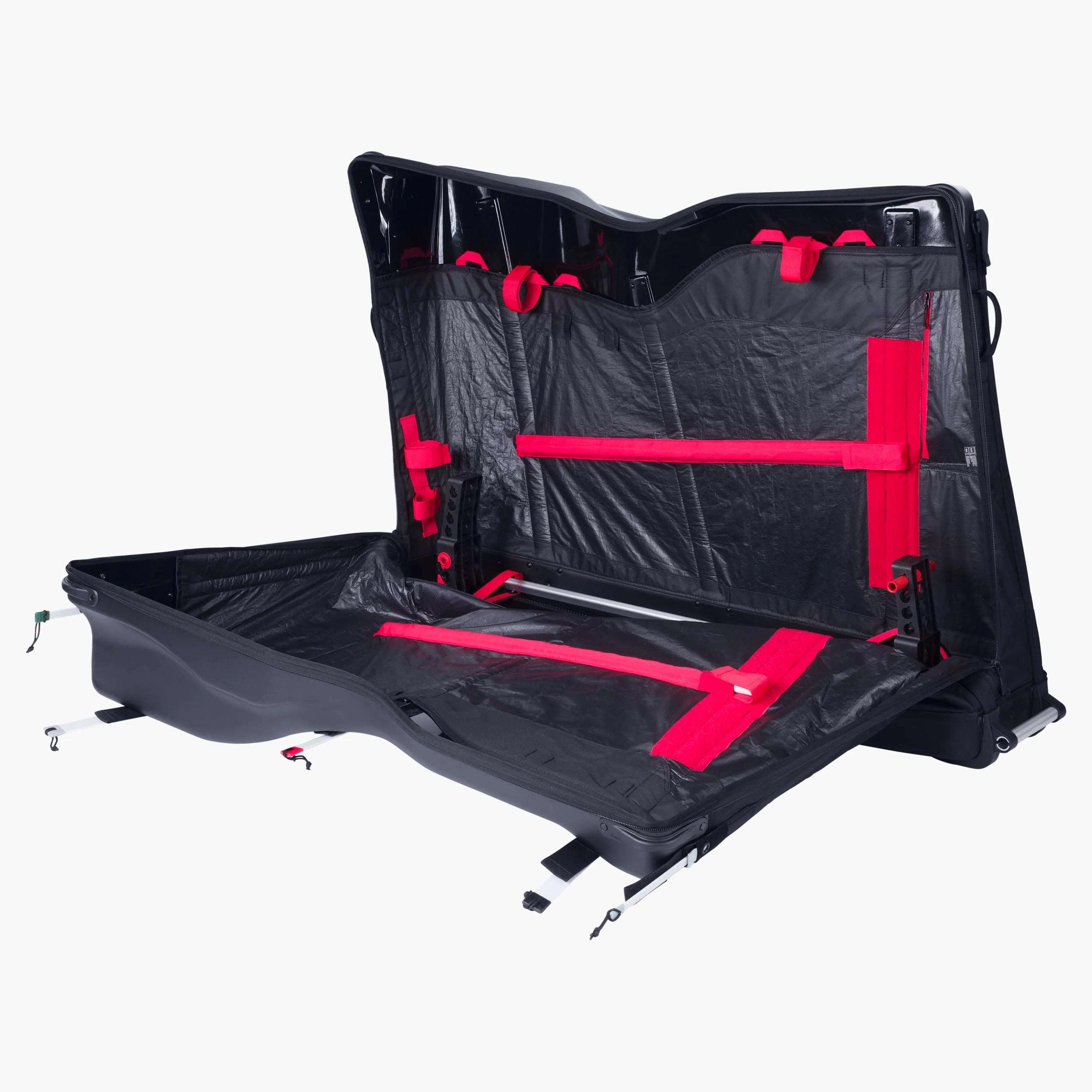 The inside of a black road bike travel bag with red straps on white background