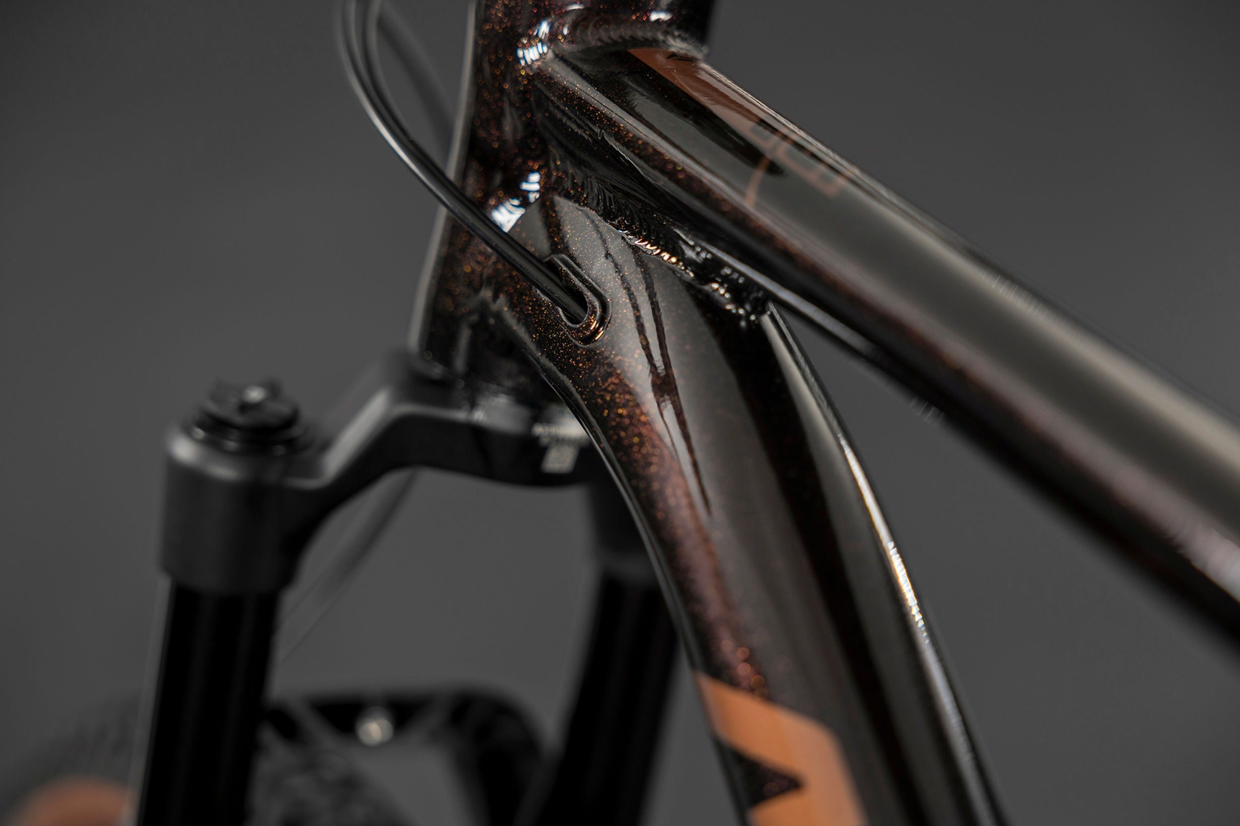 Close-up of a mountain bike frame with a dark background