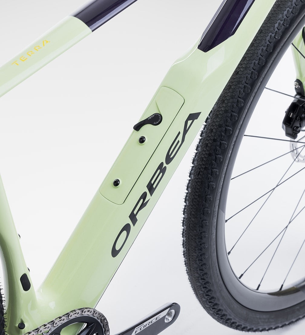 Close-up of a green Orbea Gravel Bike on a white background