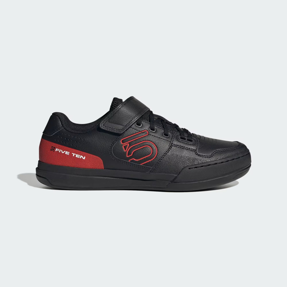 Black mountain bike shoe with red Five Ten logo on a white background