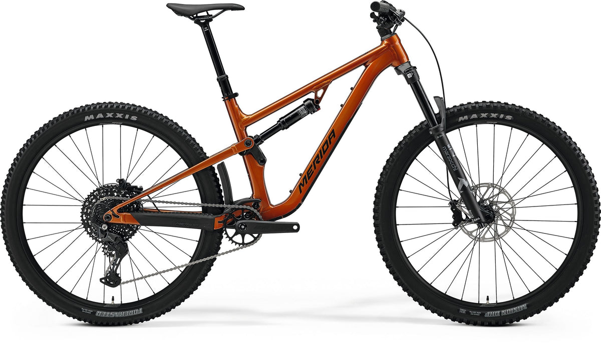 An orange Merida Dual Suspension Mountain Bike on a white background