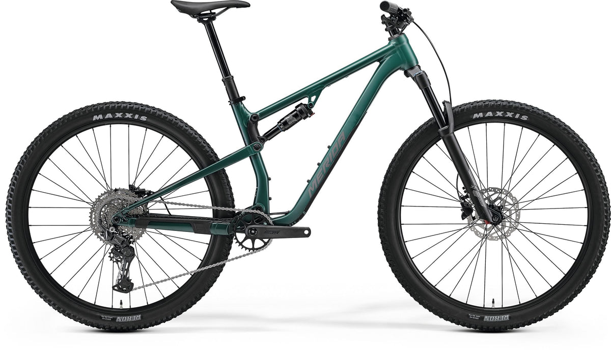 Dark green Merida Dual Suspension Mountain Bike on a white background