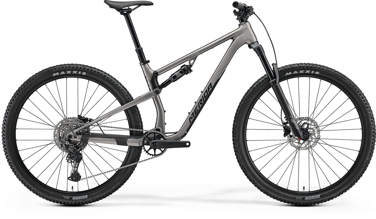 Grey Merida Dual Suspension Mountain Bike on a white background