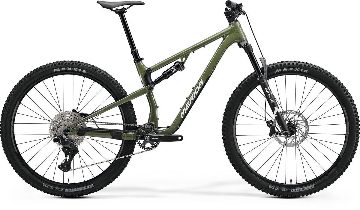 An olive green Merida Dual Suspension Bike on a white background