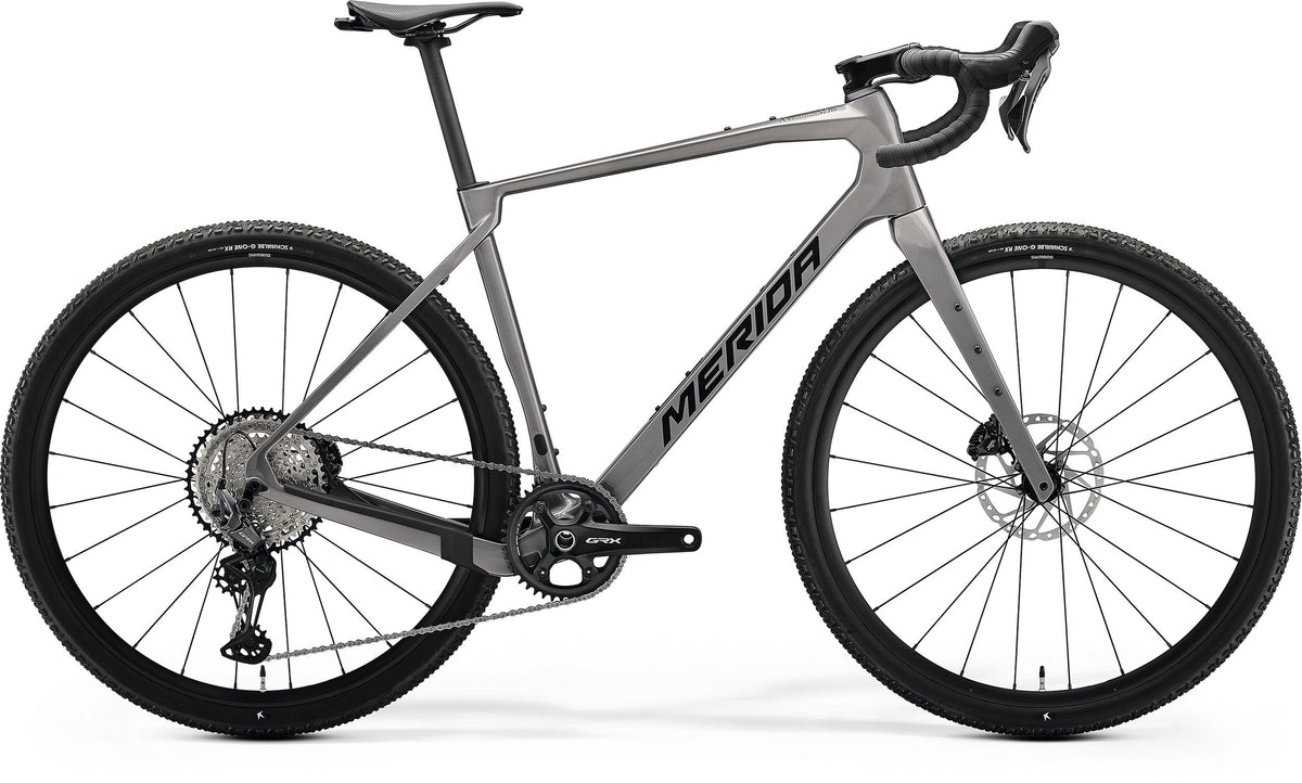 A silver Merida Gravel Bike on a white background
