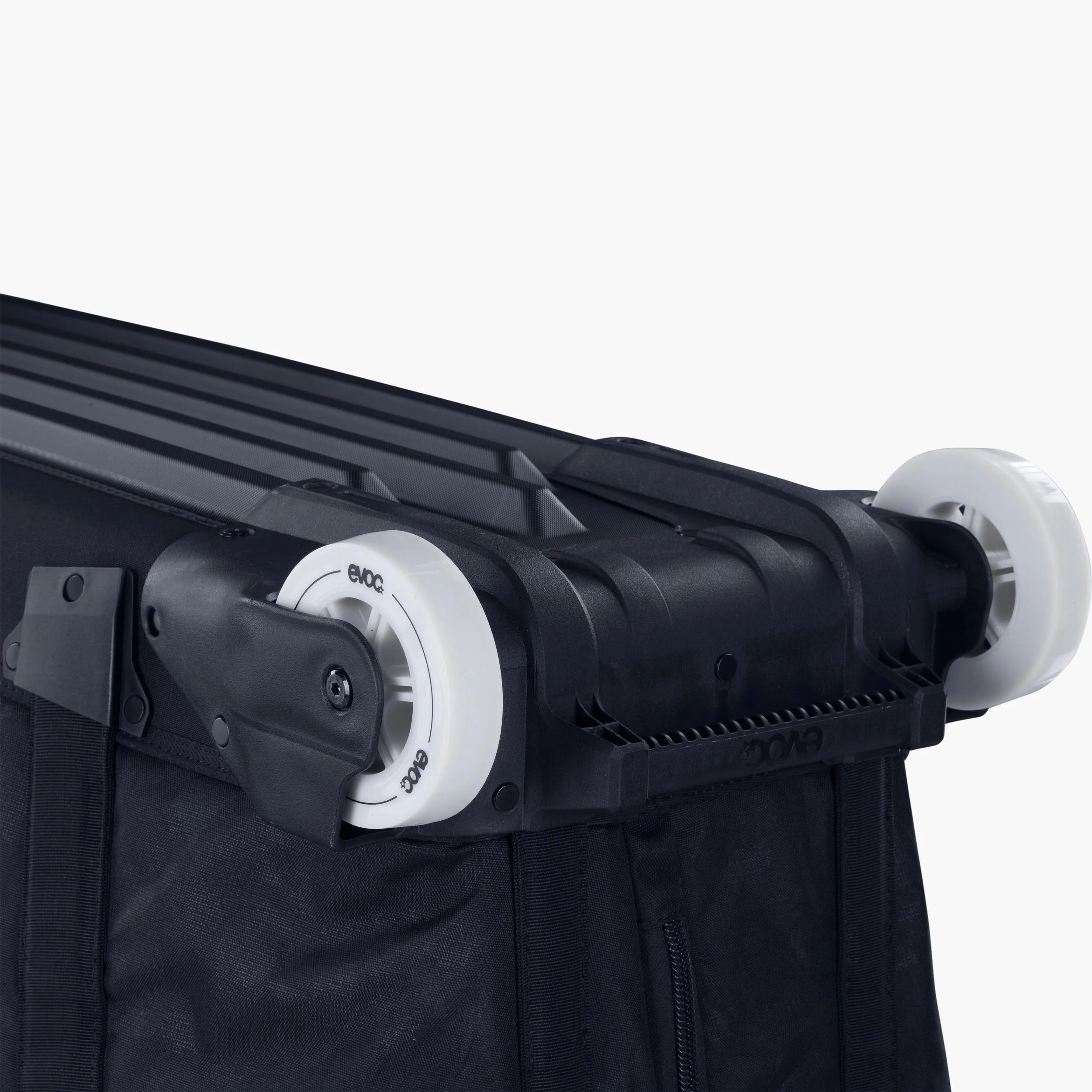 Close-up of the wheels on a black bike travel bag on a white background