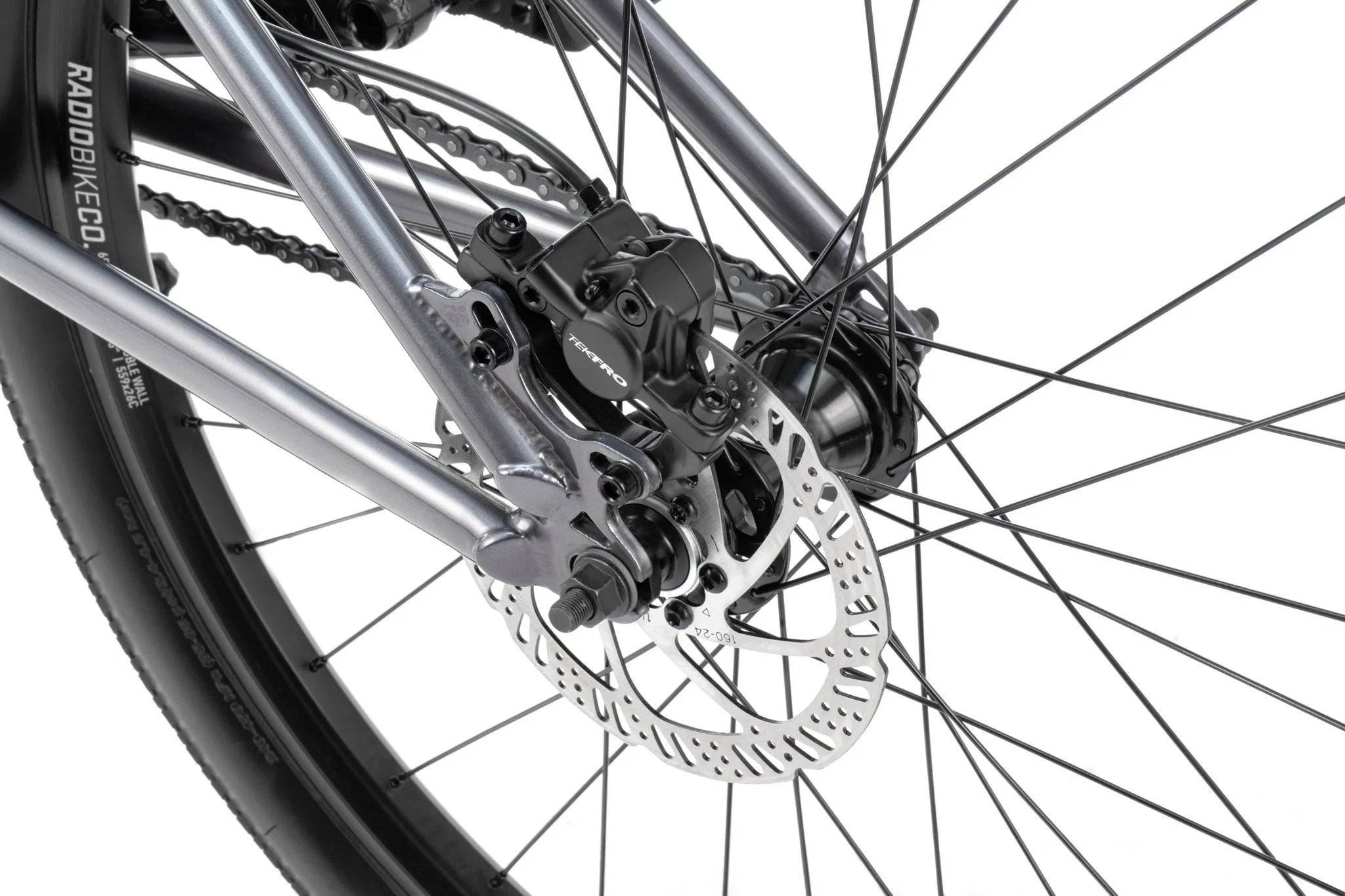 Close-up of a bicycle wheel with disc brake and chain