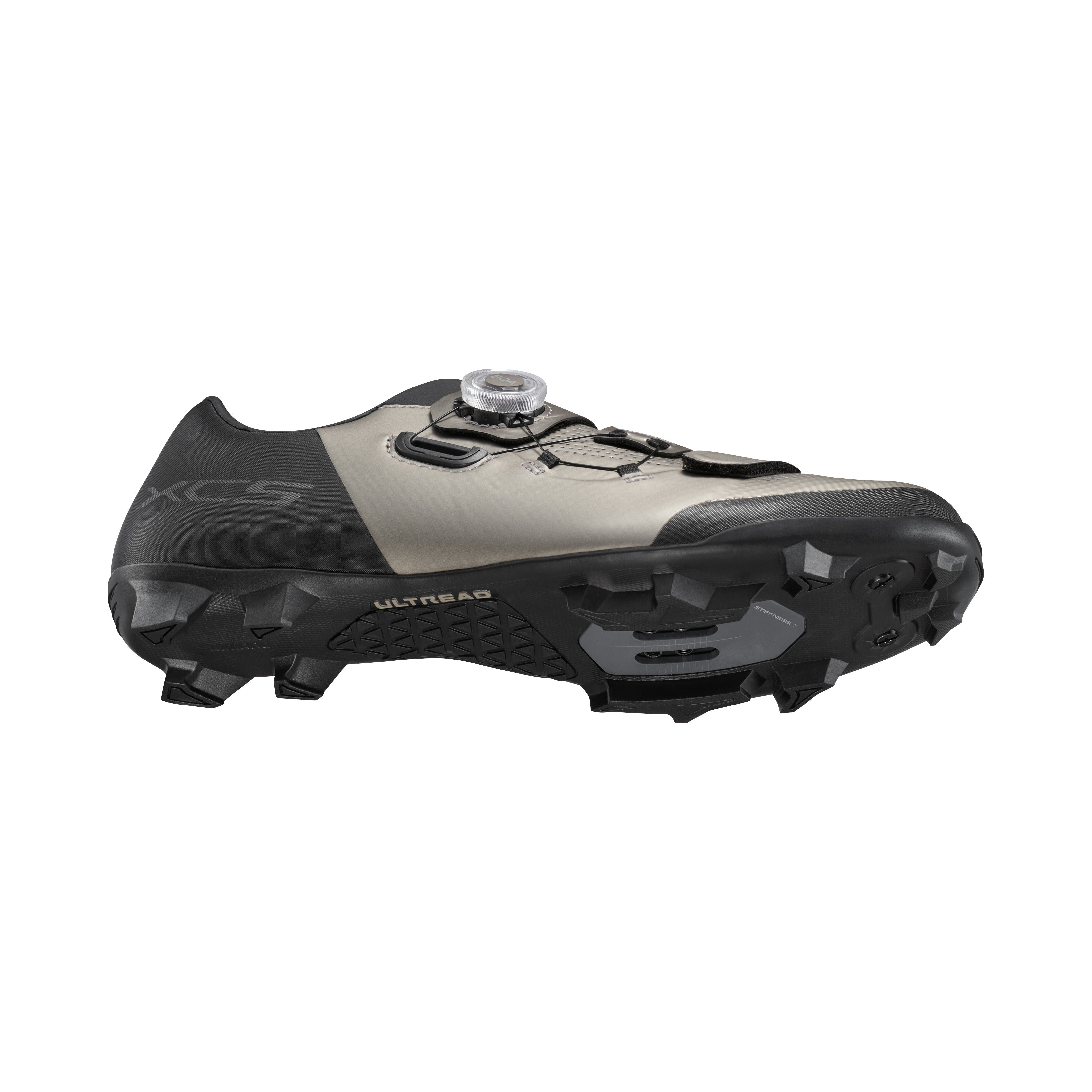 Mountain Bike shoe with black and green design on a white background