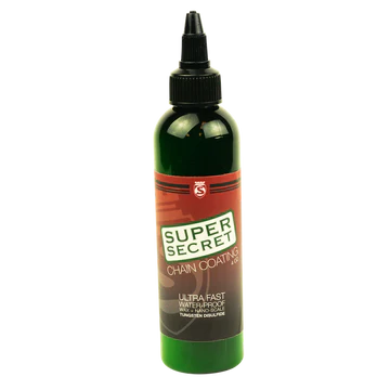 A bottle of Super Secret Chain Lube against a white background