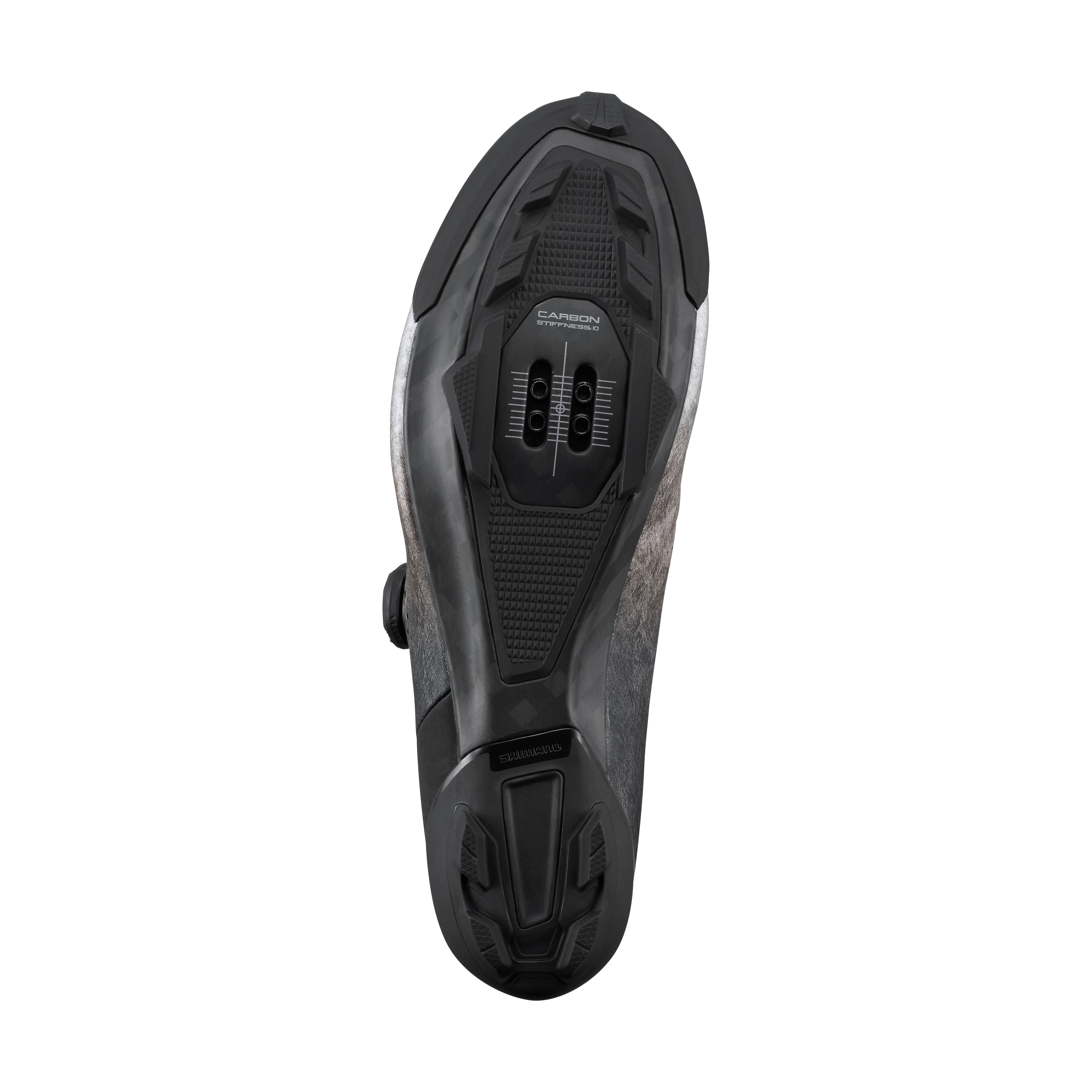 Black and gray mountain bikeshoe sole showing the cleat bolts on a white background