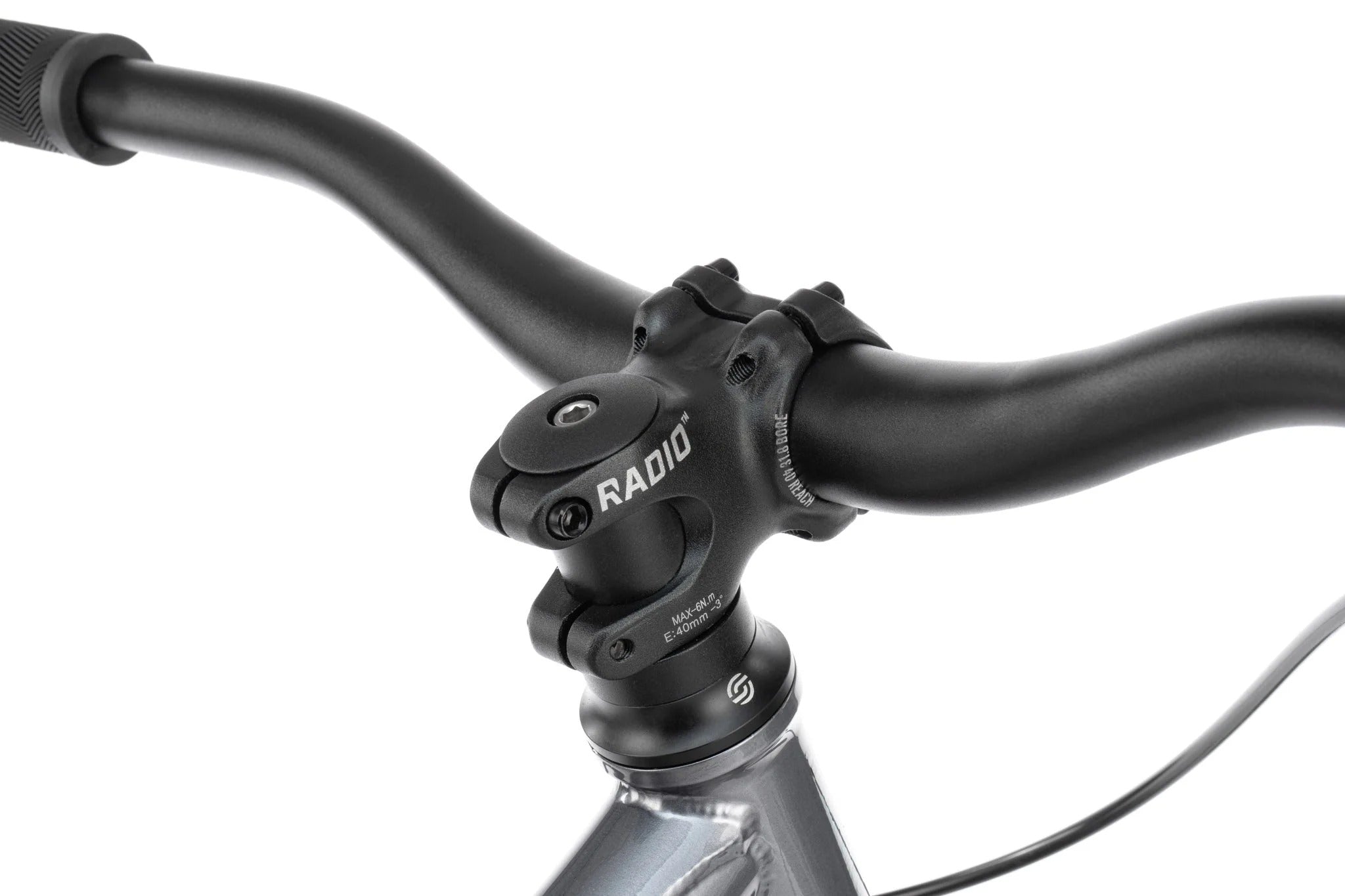 Close-up of a bicycle handlebar with 'Radio' brand on a white background