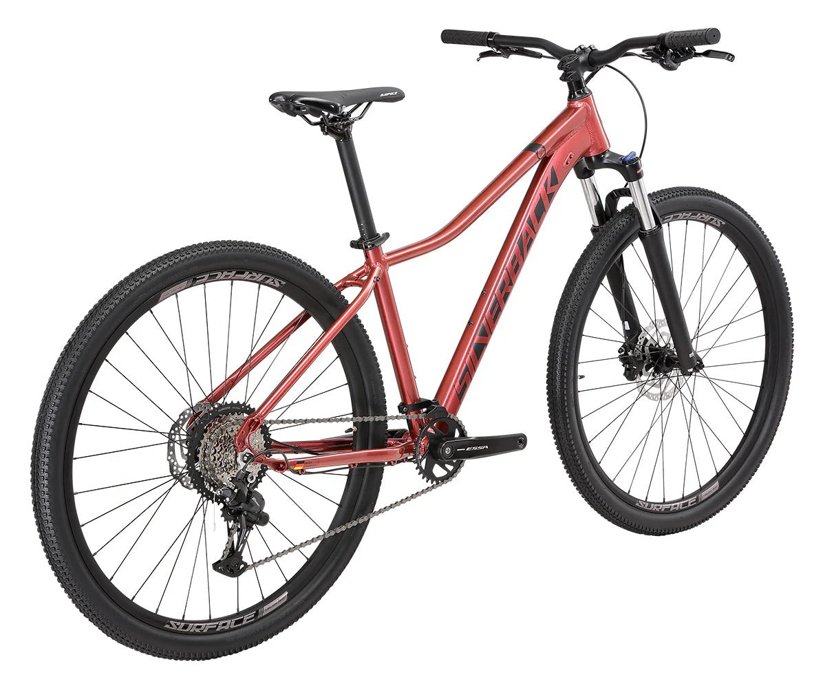 A pinky red ladies mountain bike with a white background