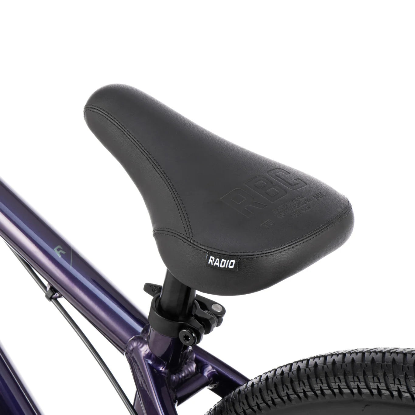 Close-up of a bicycle seat with 'Radio' branding on a white background