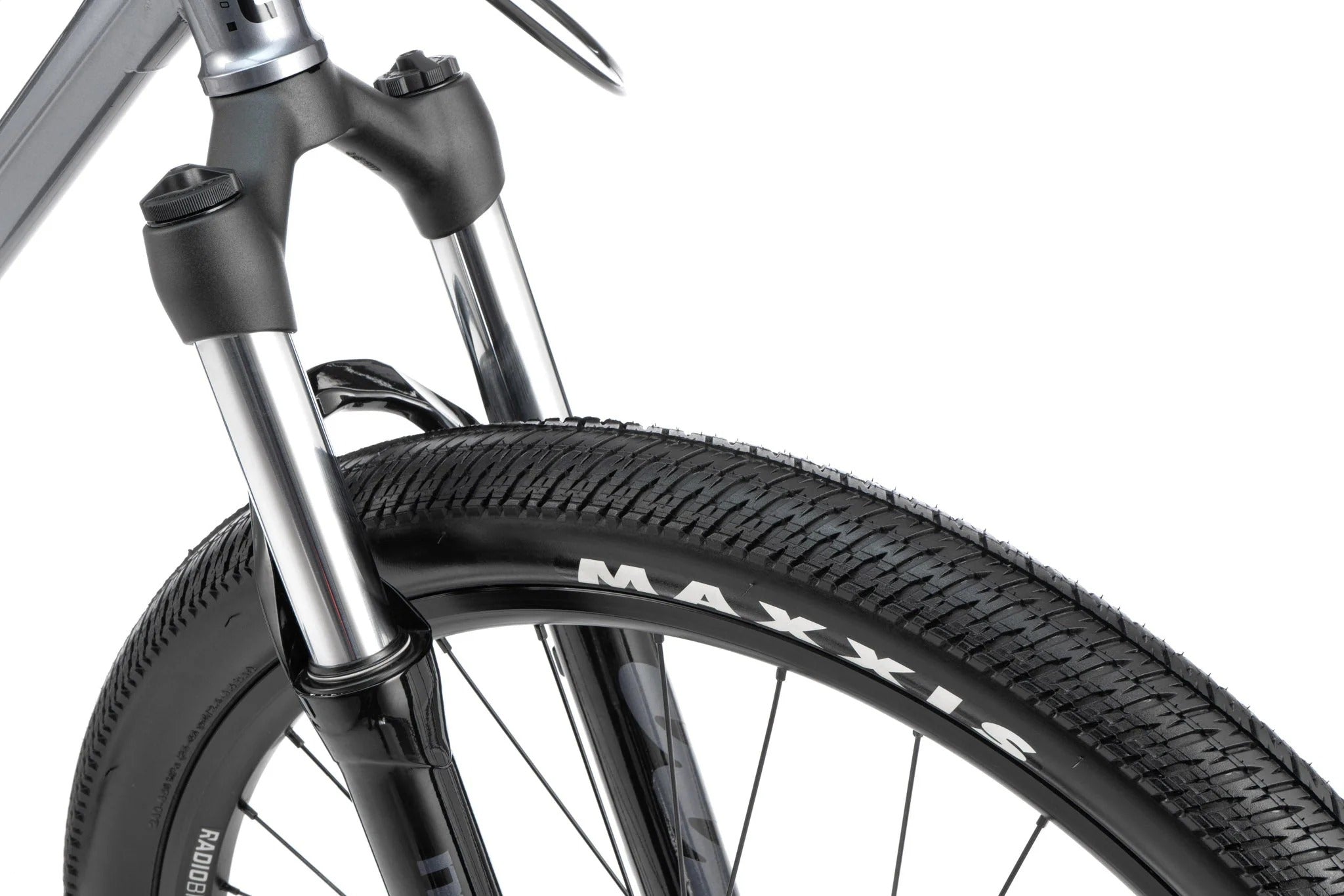 Close-up of a bicycle wheel with Maxxis tyre on a white background
