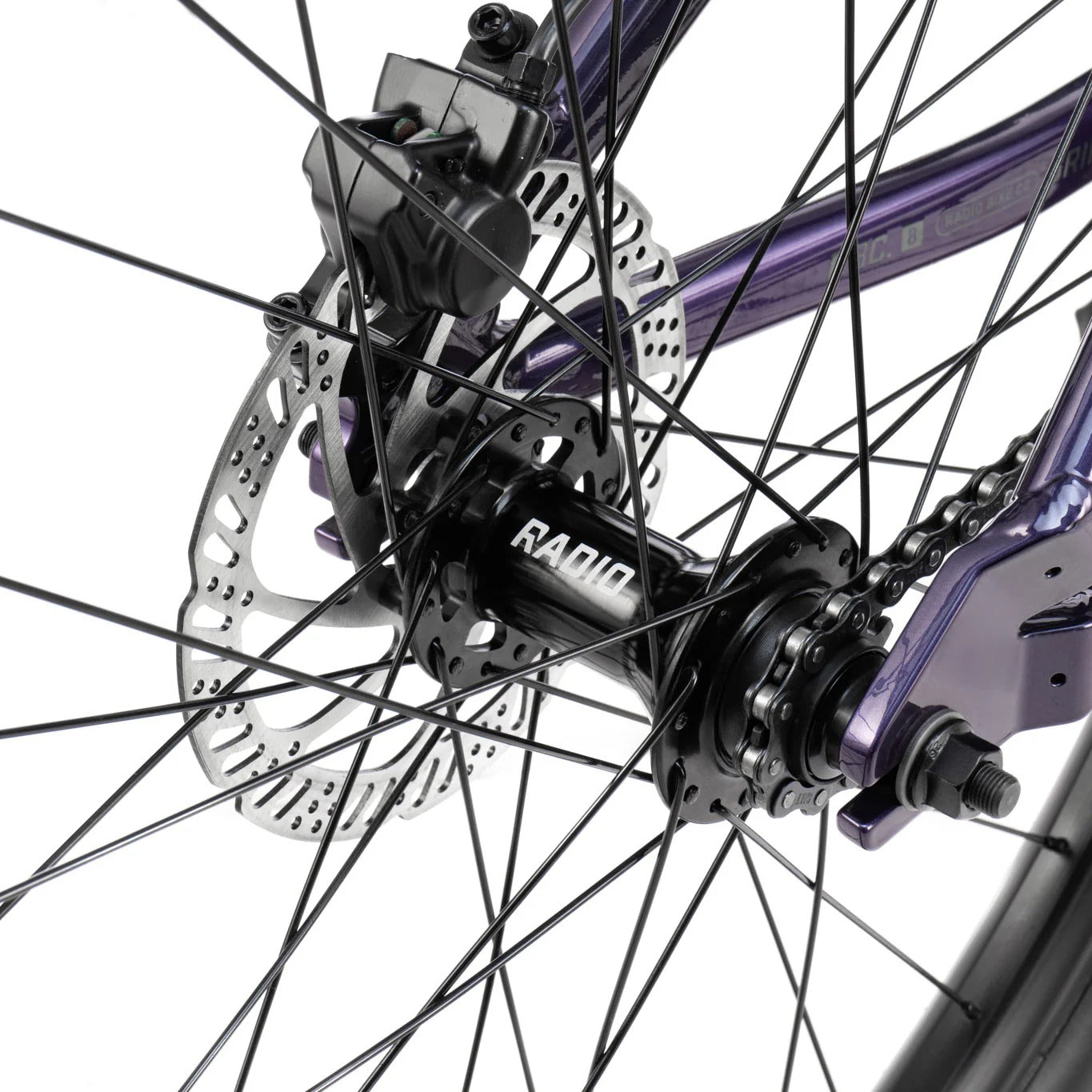 Close-up of a bicycle wheel with 'Radio' branding on a white background