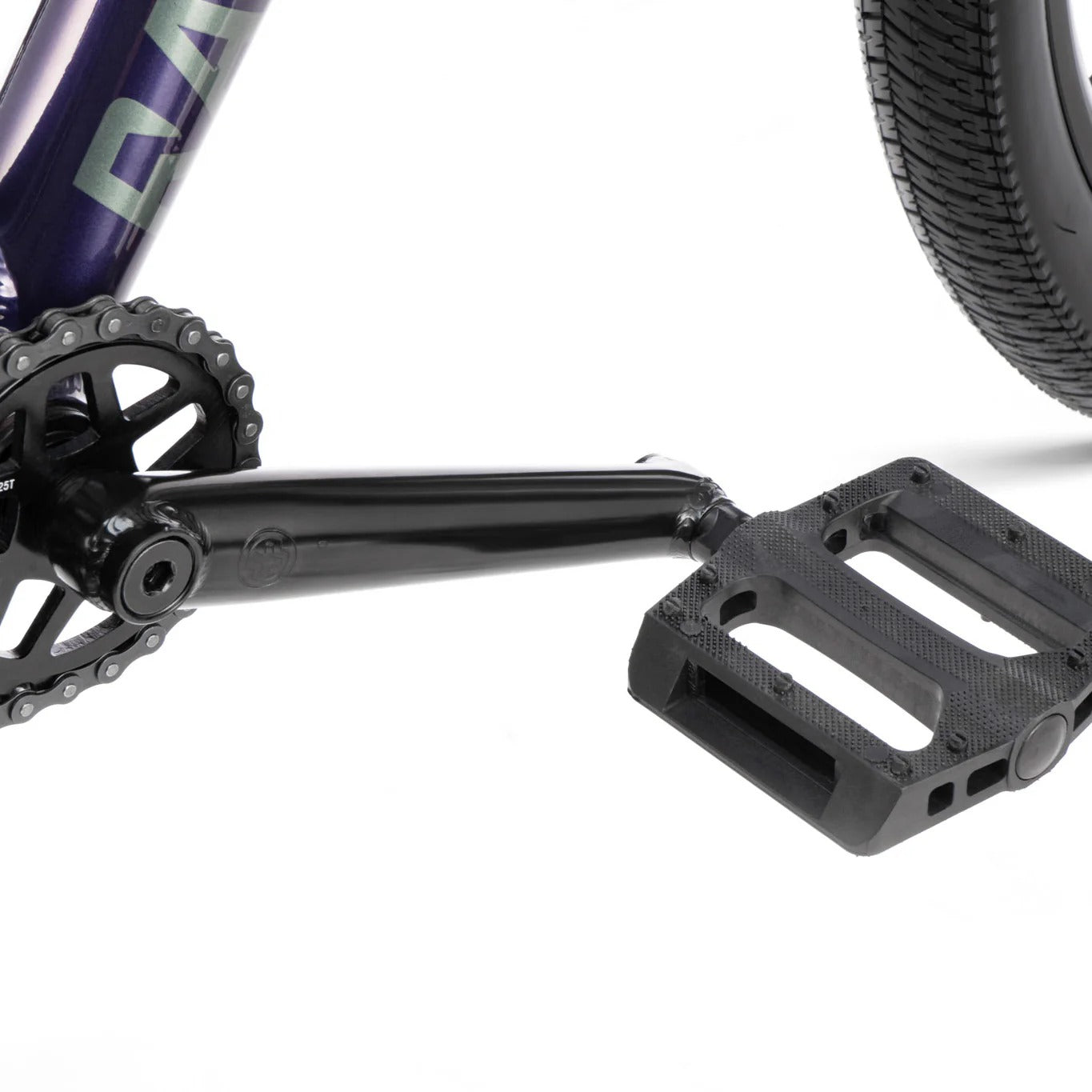 Close-up of a bicycle pedal and chain mechanism on a white background