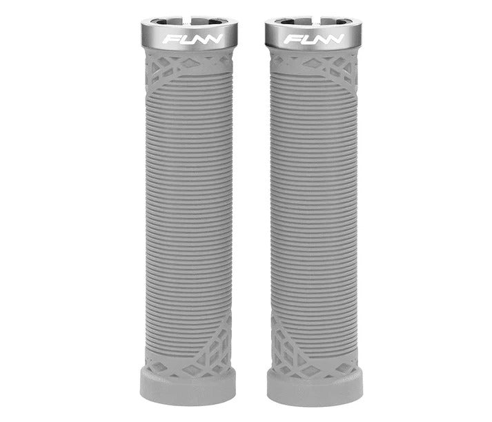 A pair of gray bicycle handlebar grips with a ribbed texture and geometric cutouts near the base, featuring a silver metal end cap printed with the brand name 'FUNN'.