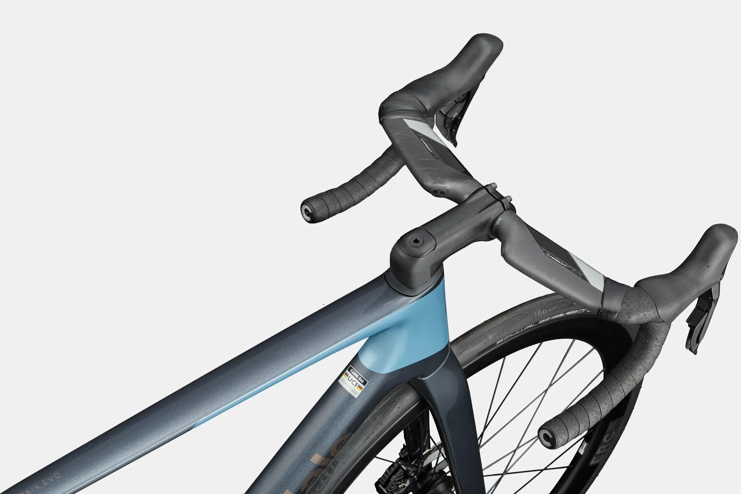 Close-up of a road bike handlebar and frame on a white background