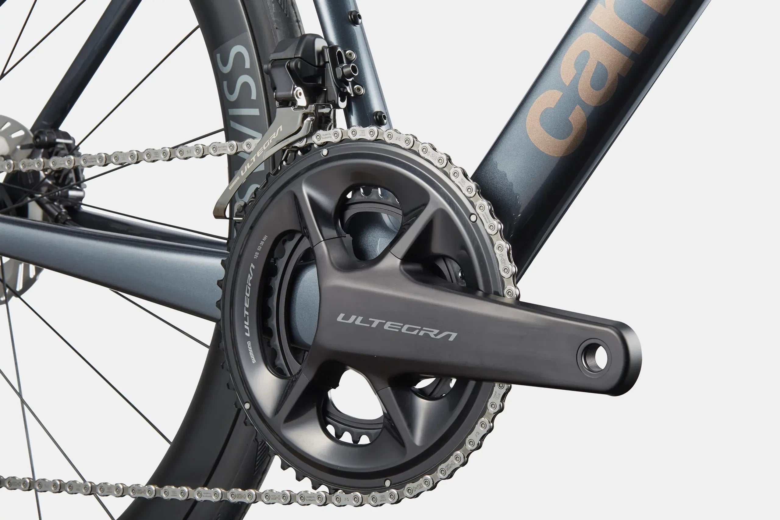 Close-up of a bicycle front crankset with 'Ultegra' branding on a gray background