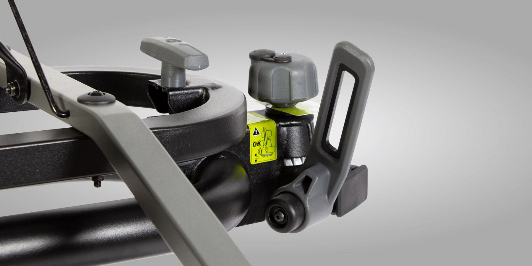 Close up of the locking mechanism for the tow ball on a bike rack against a gray background