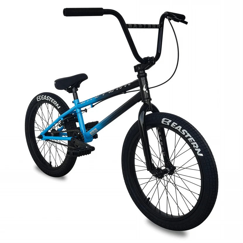 BMX bike with blue frame and black wheels on a white background