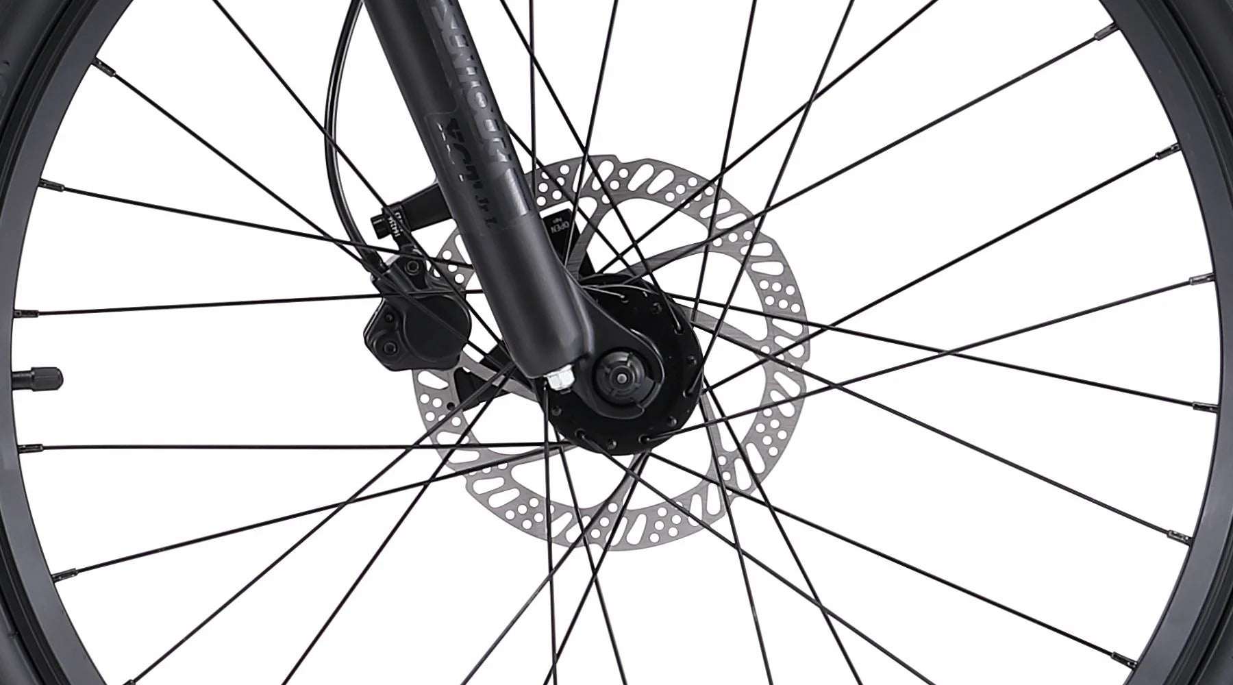 Close-up of a bicycle wheel with disc brake system on a white background
