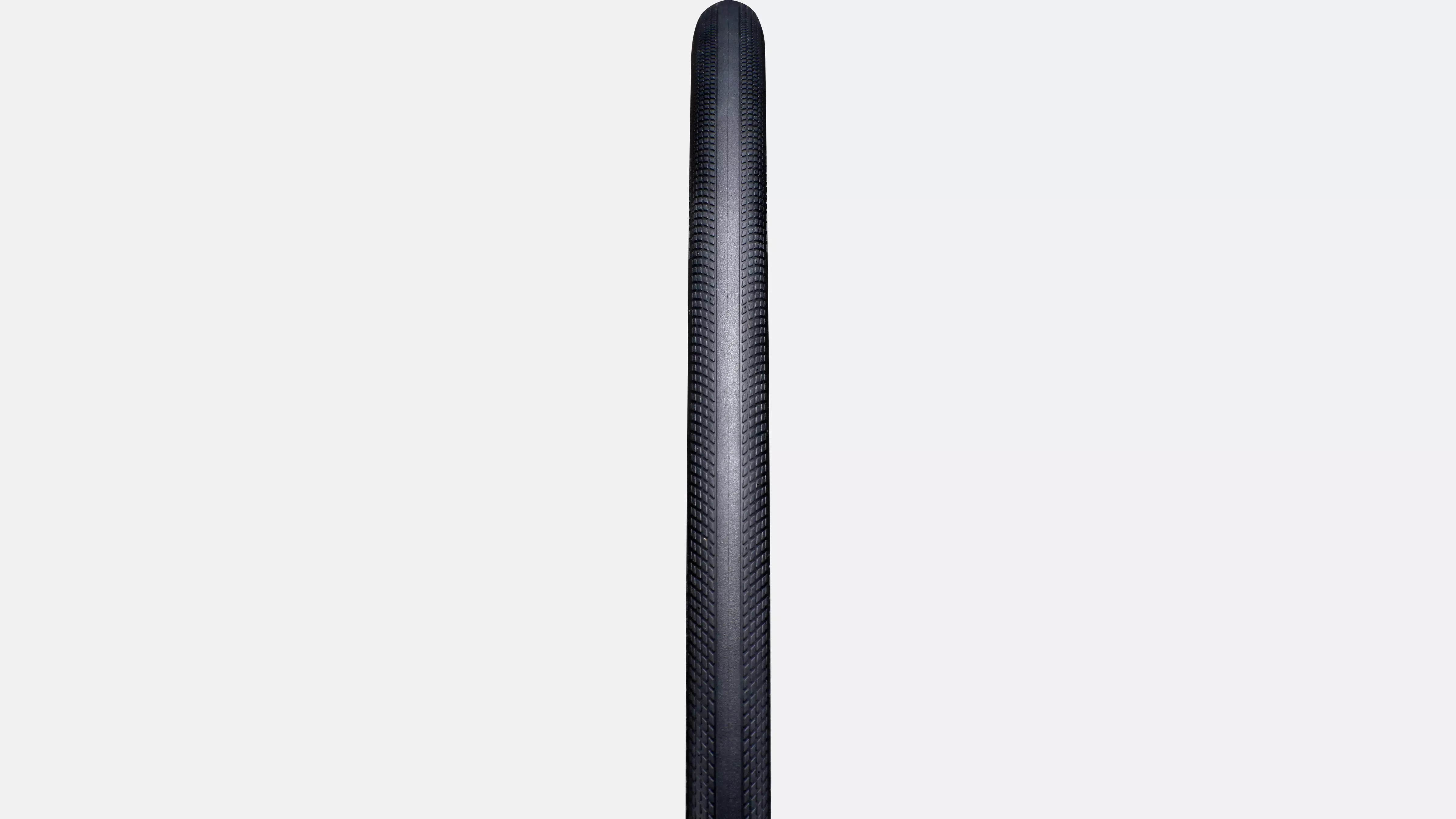 Black Road Tyre showing the tread pattern against a white background