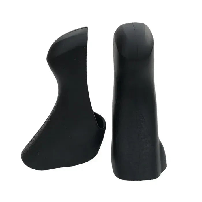 A pair of black road bike hood covers for shifters on a white background