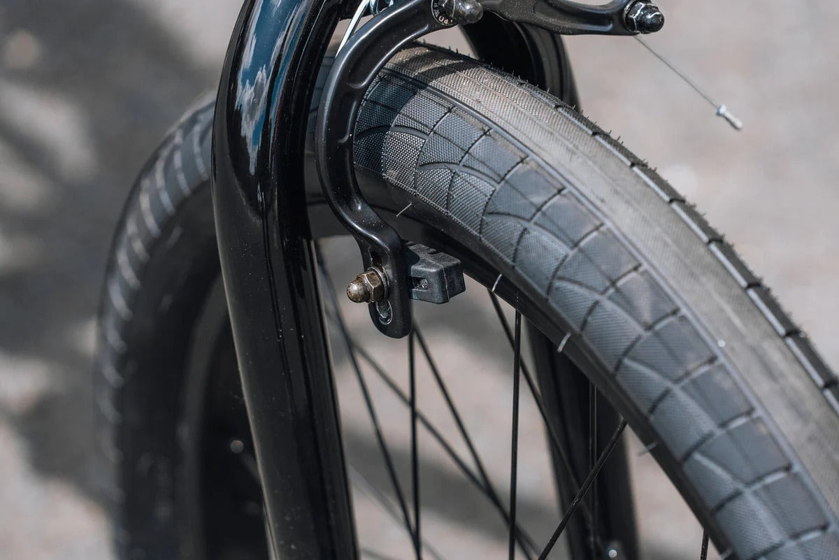 Close-up of a bmx tyre and rim with a blurred background