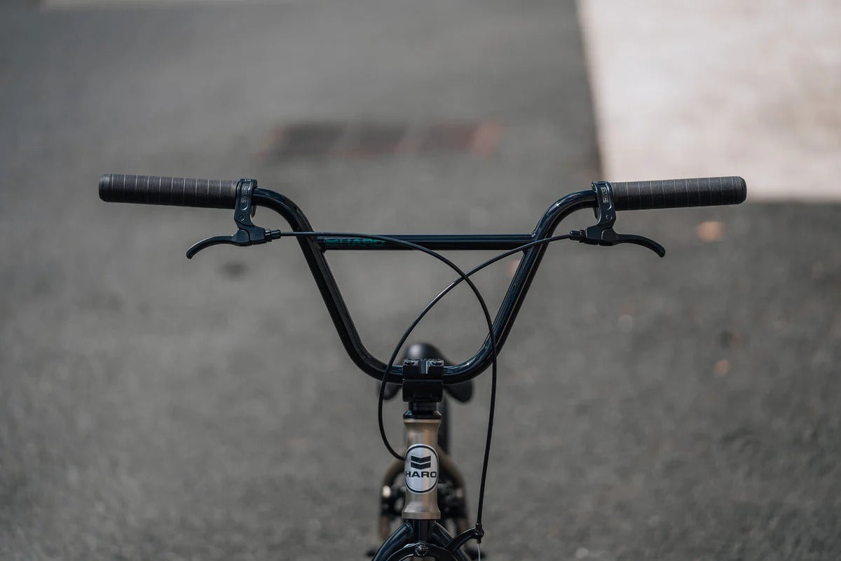 Close-up of a BMX Bike handlebar with a blurred background