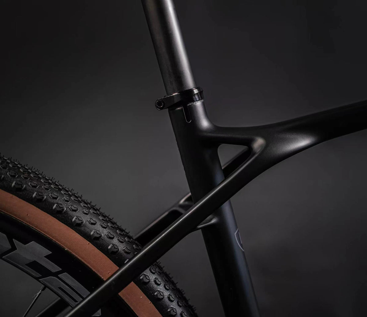 Close-up of a bicycle Seat Stay frame and tre on a dark background