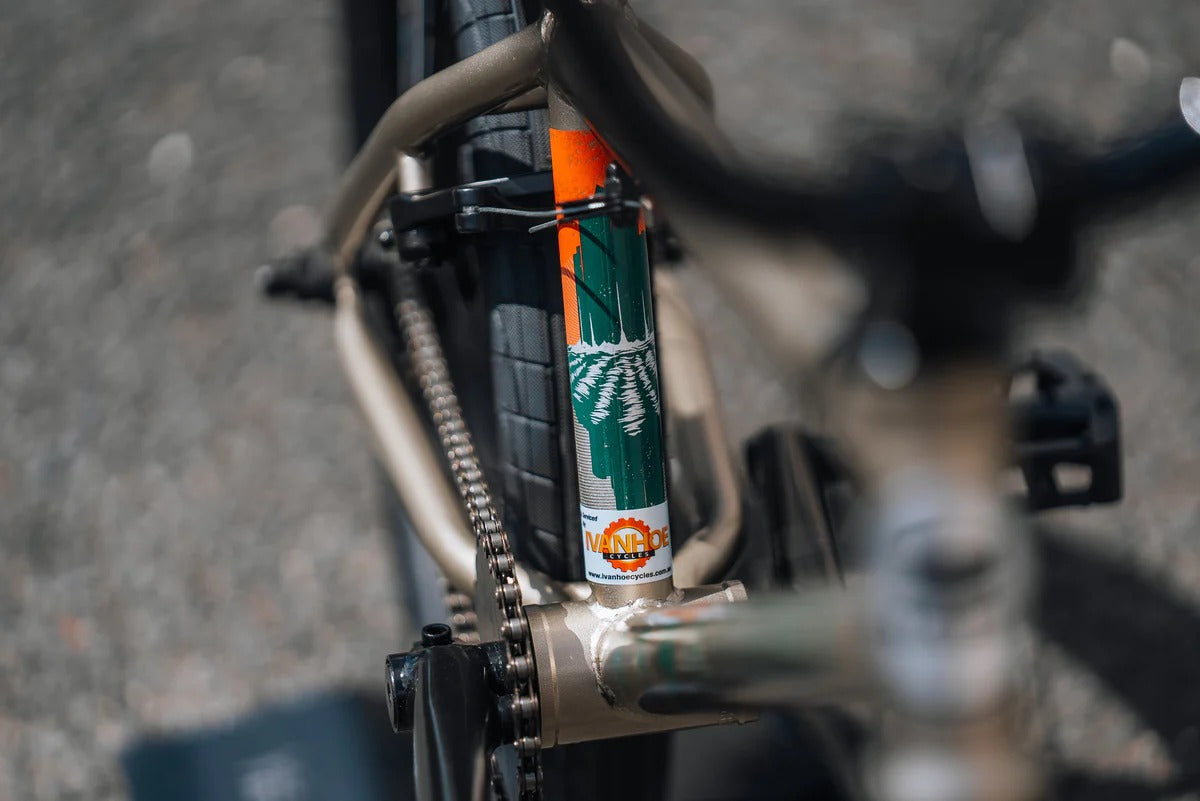 Close-up of a BMX Bike chain and gear system with a blurred background