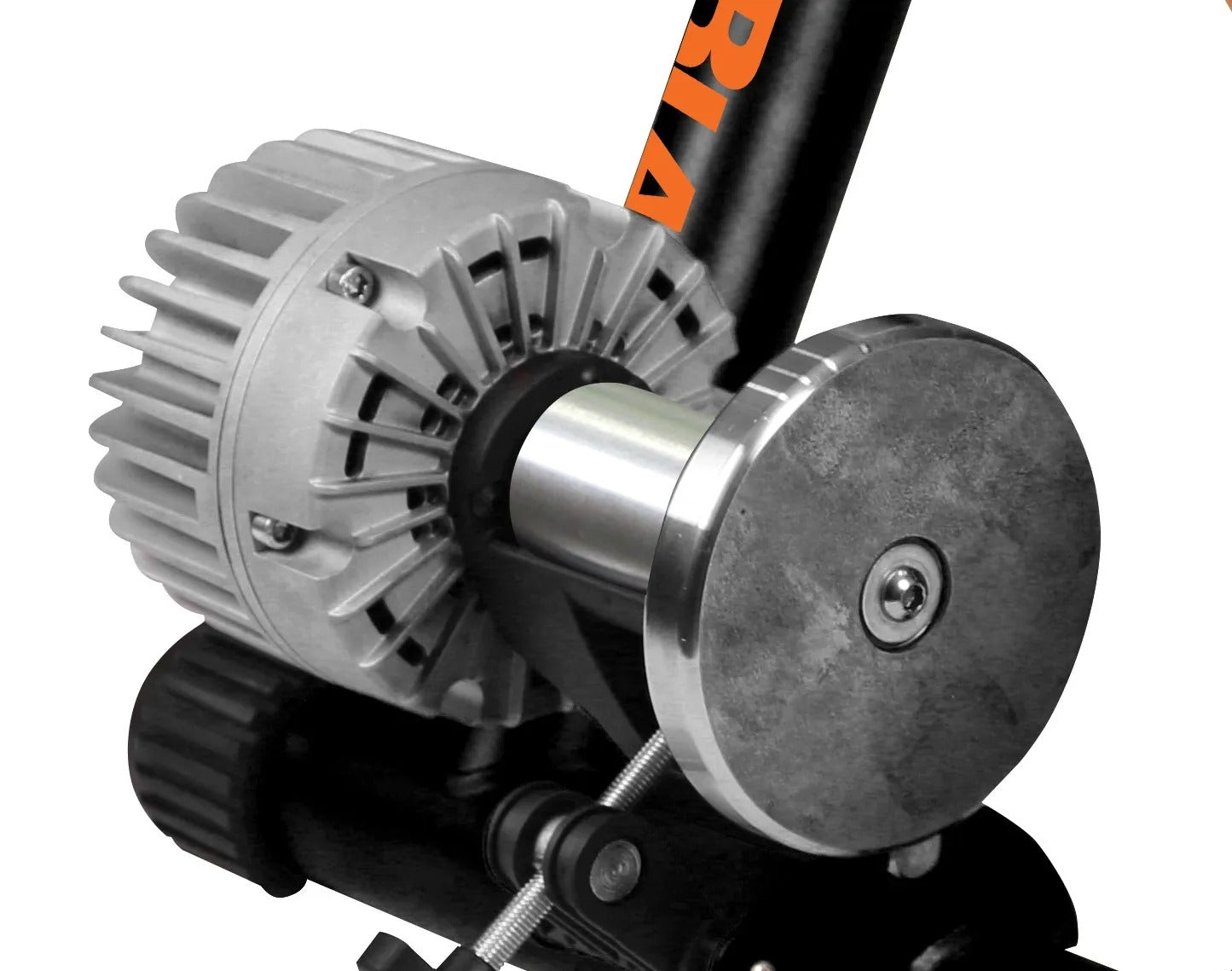 Close-up of the flywheel on an indoor bike trainer with 'KTM' branding on a white background 