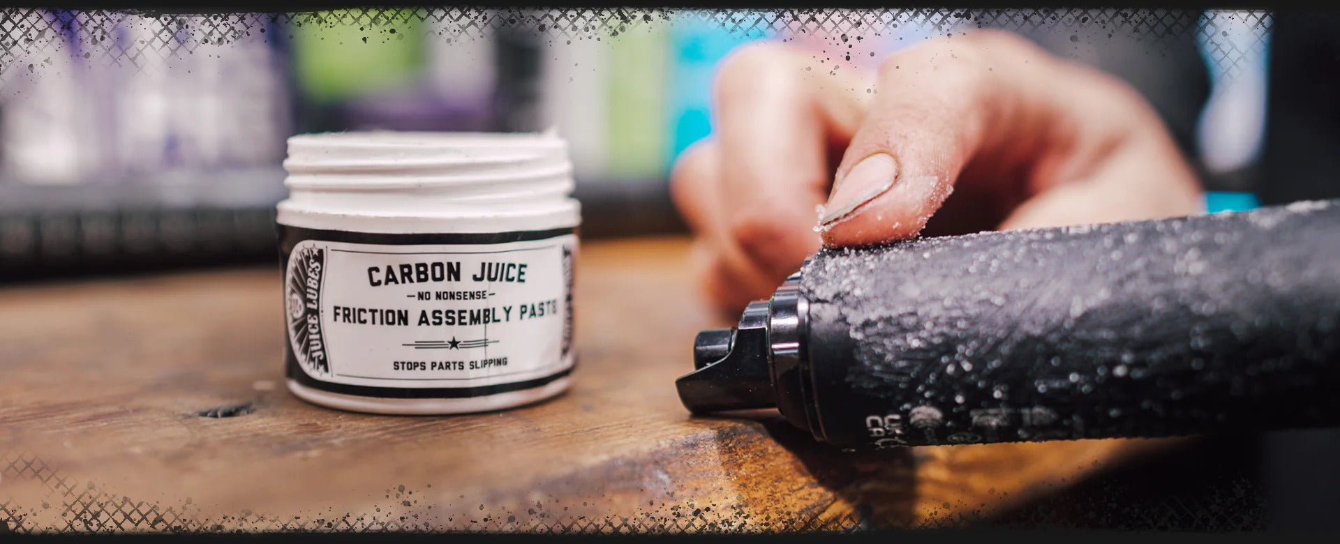 Person applying Carbon Juice friction assembly paste to a bike part