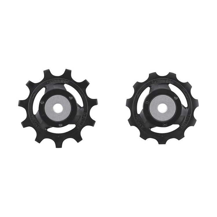 Two black bicycle pulley wheels on a white background