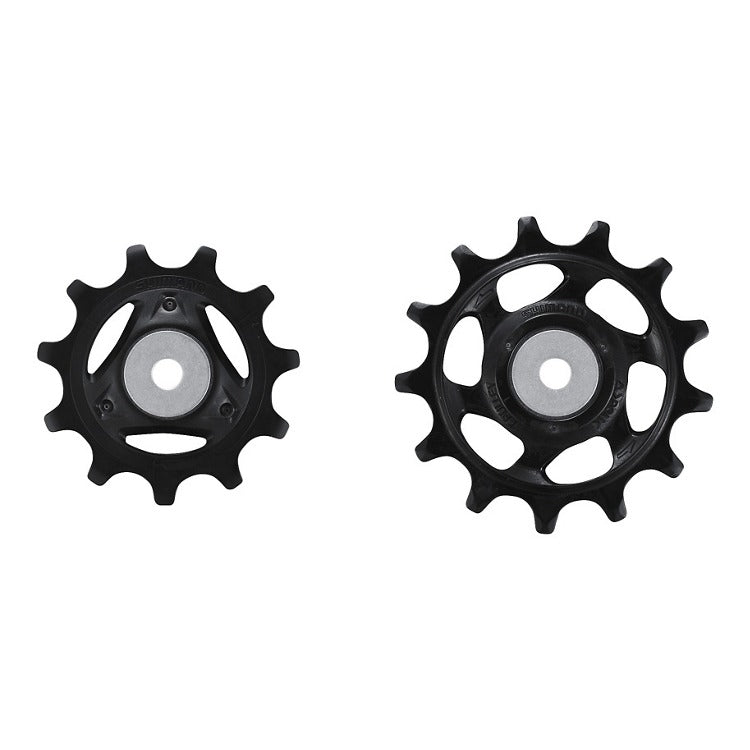 Two black bicycle pulley wheels on a white background